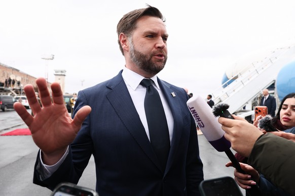 U.S. Vice President J.D. Vance speaks to the media before boarding Air Force Two upon departure for Azerbaijan, at Zvartnots International Airport in Yerevan, Armenia, Tuesday Feb. 10, 2026. (Kevin La ...