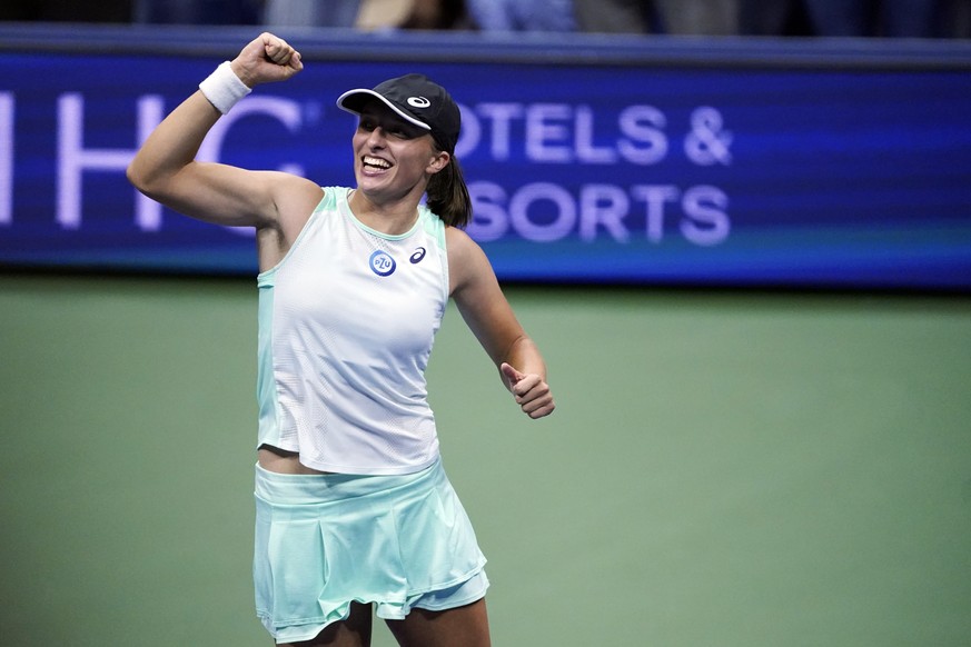 Iga Swiatek, of Poland, reacts after defeating Aryna Sabalenka, of Belarus, in the semifinals of the U.S. Open tennis championships, Thursday, Sept. 8, 2022, in New York. (AP Photo/Julia Nikhinson)