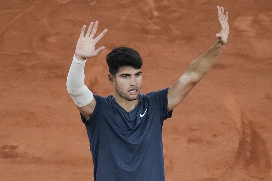 Spain&#039;s Carlos Alcaraz celebrates winning his first round match of the French Open tennis tournament against Jeffrey John Wolf of the U.S. at the Roland Garros stadium in Paris, Sunday, May 26, 2 ...
