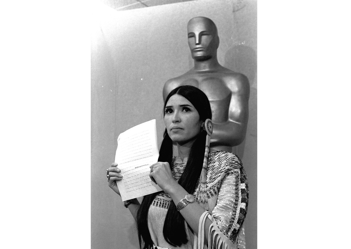 FILE - Sacheen Littlefeather appears at the Academy Awards ceremony to announce that Marlon Brando was declining his Oscar as best actor for his role in "The Godfather," on March 27, 1973. T ...