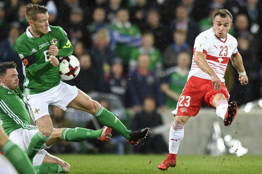 Northern Ireland&#039;s midfielder Steven Davis, left, fights for the ball with Switzerland&#039;s midfielder Xherdan Shaqiri, right, during the 2018 Fifa World Cup play-offs first leg soccer match No ...