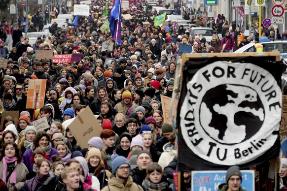 People take part in a &#039;Fridays For Future&#039; protest rally in Berlin, Germany, Friday, March 3, 2023. Climate protesters are gathering in Berlin and dozens of other German cities to demand tou ...