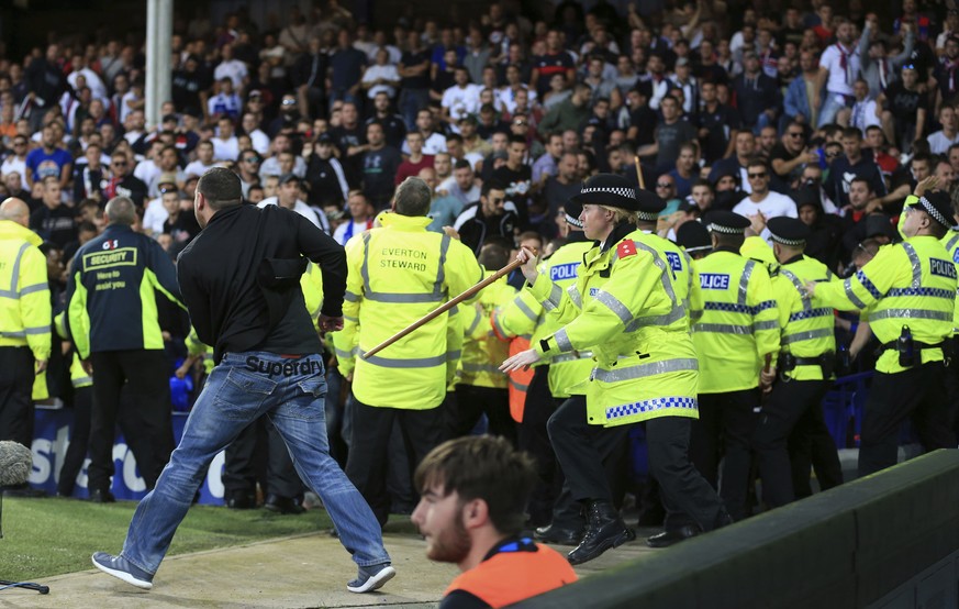 Security close round Hajduk Split fans during the Europa League Play-Off, First Leg soccer match between Everton and Hajduk Split at Goodison Park, Liverpool, England, Thursday, Aug. 17, 2017. (Nigel  ...