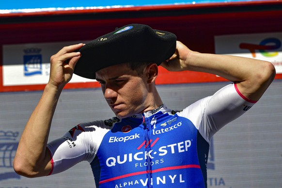 Qst-Quick-Step&#039;s Remco Evenepoel with a basque beret on his head celebrates on the podium after winning the San Sebastian Cycling Classic race, in San Sebastian, northern Spain, Saturday, July 30 ...