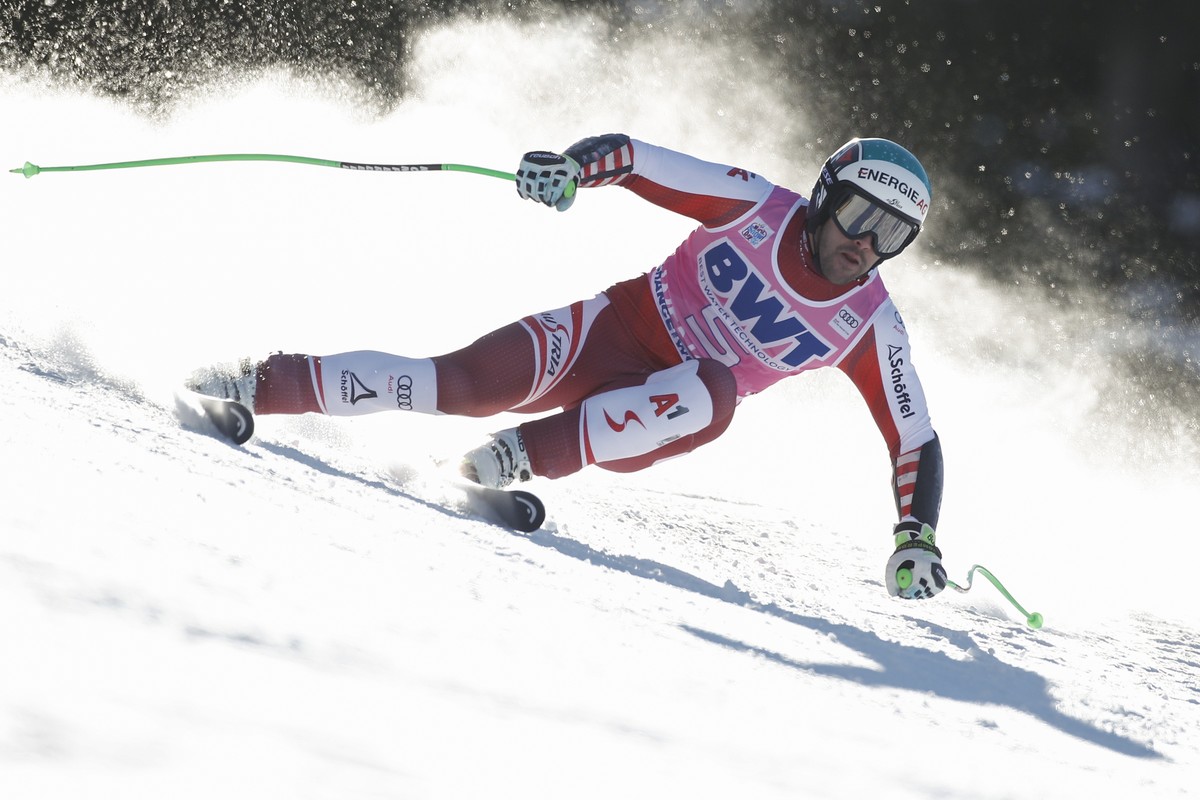 Austria's Vincent Kriechmayr speeds down the course during an alpine ski, men's World Cup super G, in Wengen, Switzerland, Thursday, Jan. 13, 2022. (AP Photo/Gabriele Facciotti)