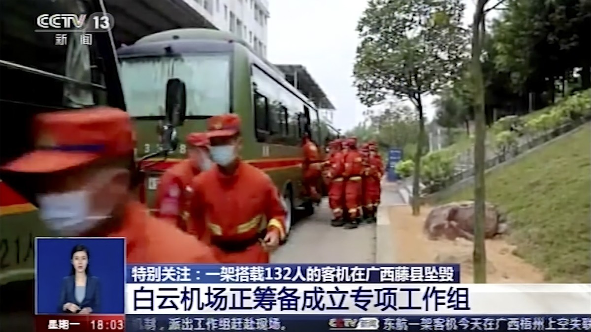In this image taken from video footage run by China's CCTV, emergency personnel prepare to travel to the site of a plane crash near Wuzhou in southwestern China's Guangxi Zhuang Autonomous R ...