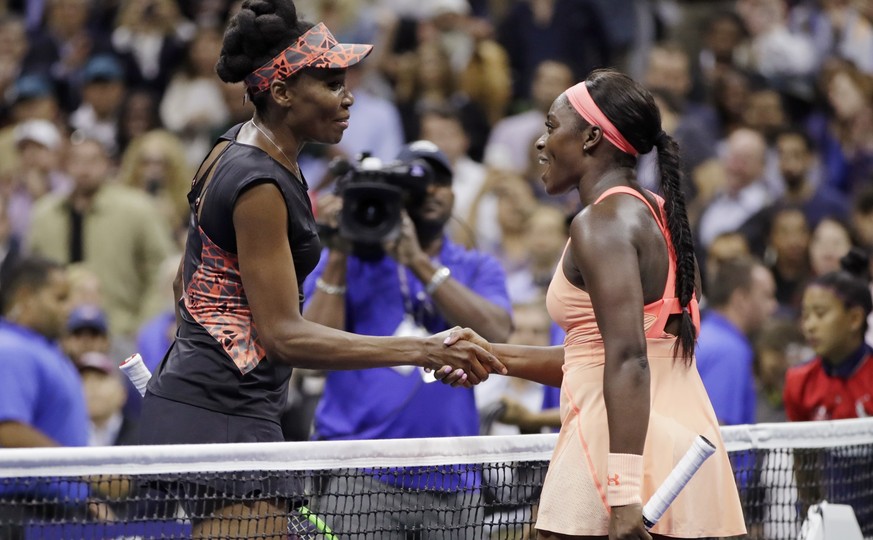 Venus Williams, of the United States, left, shakes hands with Sloane Stephens, of the United States, after Stephens won their semifinal match of the U.S. Open tennis tournament, Thursday, Sept. 7, 201 ...