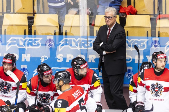 epa12126060 Roger Bader, head coach of Austria national ice hockey team, reacts, during the 2025 IIHF Ice Hockey World Championship quarter final match between Switzerland and Austria, at the Jyske Ba ...