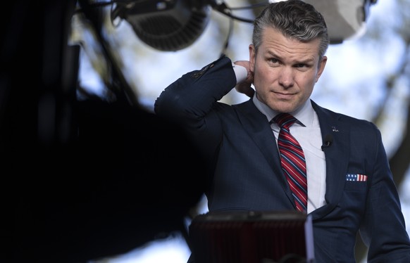 Defense Secretary Pete Hegseth prepares to give a television interview outside the White House, Friday, March 21, 2025, in Washington. (AP Photo/Mark Schiefelbein)
Pete Hegseth