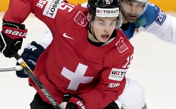 Switzerlands Gregory Hofmann controls a puck during the Ice Hockey World Championships Group A match between Switzerland and Kazakhstan, in Moscow, Russia, on Saturday, May 7, 2016. (AP Photo/Ivan Se ...