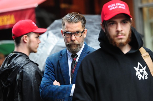 CENTER Gavin McInnes attends rally - Alt-right protestors hold rally in front of CUNY on East 42nd St. and 3rd ave to protest against CUNY's choice of Muslim-American activist Linda Sarsour as commenc ...