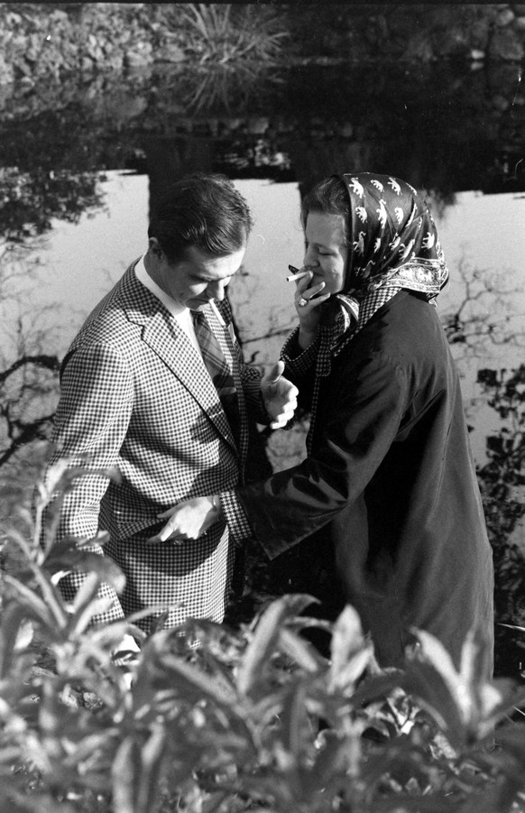 Princess Margrethe II smoking cigarette with husband Prince Henrik, Denmark, 1967.

Carlo Bavagnoli/The LIFE Picture Collection

Special Instructions: Premium. Please contact us for licensing use of t ...