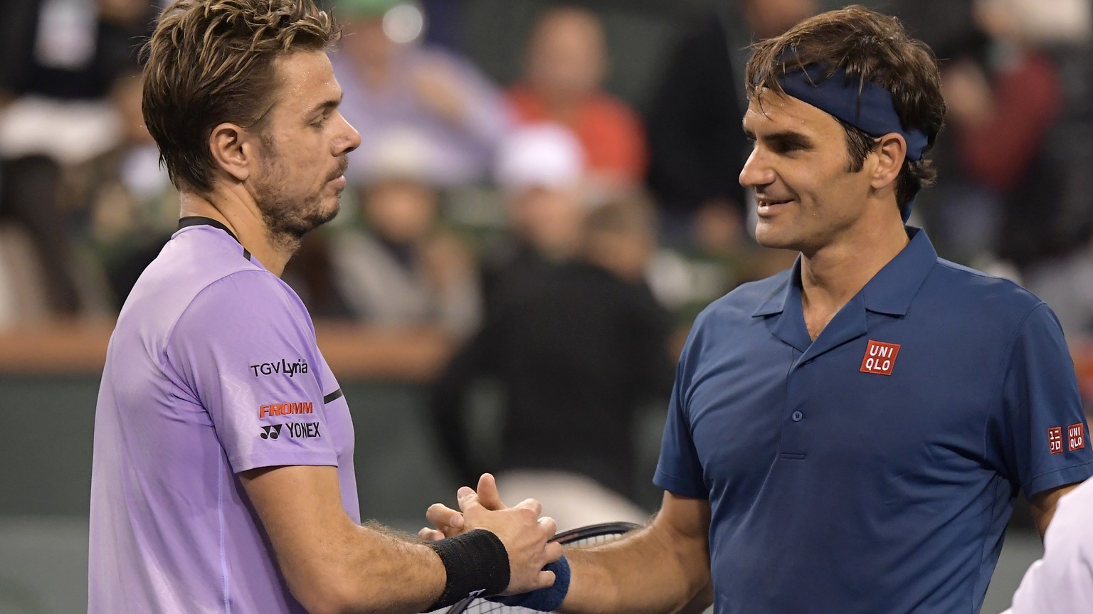 Stan Wawrinka left, congratulates Roger Federer at the BNP Paribas Open tennis tournament Tuesday, March 12, 2019 in Indian Wells, Calif. (AP Photo/Mark J. Terrill)