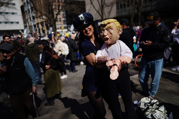 epa10558357 Protesters outside New York Criminal Court in New York, New York, U.S., April 04, 2023. A Manhattan grand jury voted last week to indict former President Donald J. Trump and he will...