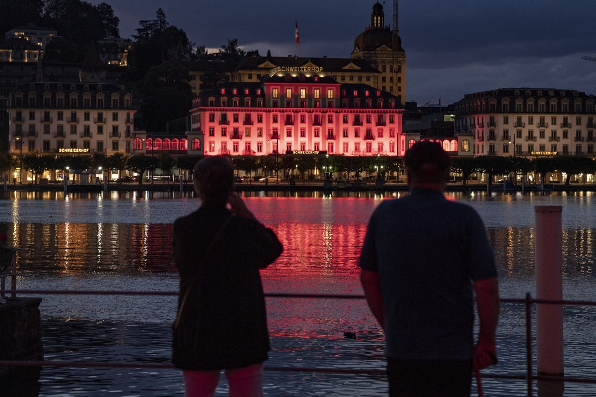The Hotel Schweizerhof is pictured lit up in red during the action "Night of light" campaign, in Luzern, Switzerland, June 22, 2020. In the night from 22.06. to 23.06.2020, numerous companie ...