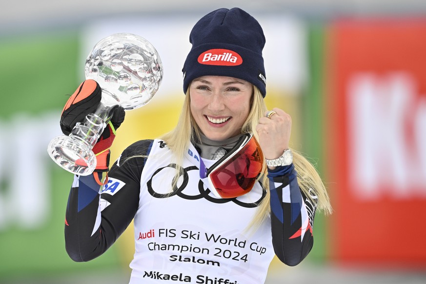epa11223910 USA&#039;s Mikaela Shiffrin celebrates with the slalom overall winner&#039;s crystal globe after the Women&#039;s Slalom race at the FIS Alpine Skiing World Cup finals in Saalbach Hintergl ...