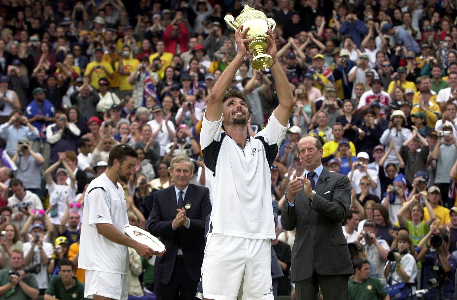 9 Jul 2001: Goran Ivanisevic of Croatia lifts the Wimbledon trophy after beating Patrick Rafter of Australia during the Men&#039;s Final of The All England Lawn Tennis Championship at Wimbledon, Londo ...