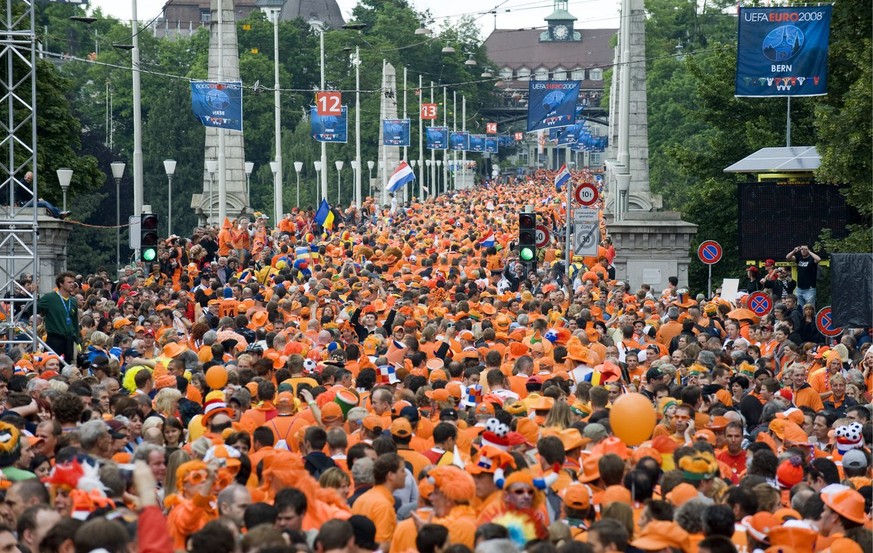 Dutch fans march over the Kornhaus bridge on their way to the stadium for the preliminary round group C match of the Euro 2008 European Soccer Championships, opposing Netherlands to Romania, in the ce ...