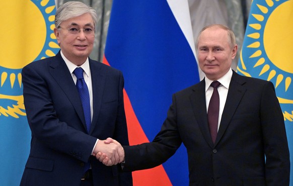 Russian President Vladimir Putin, right, and Kazakhstan&#039;s President Kassym-Jomart Tokayev shake hands after their joint news conference following the talks in the Kremlin in Moscow, Russia, Thurs ...