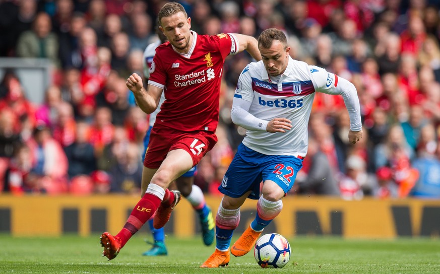 epa06698575 Liverpool’s Jordan Henderson (L) in action with Stoke City’s Xherdan Shaqiri (R) during the English Premier League soccer match between Liverpool FC and Stoke City FC held at the Anfield,  ...