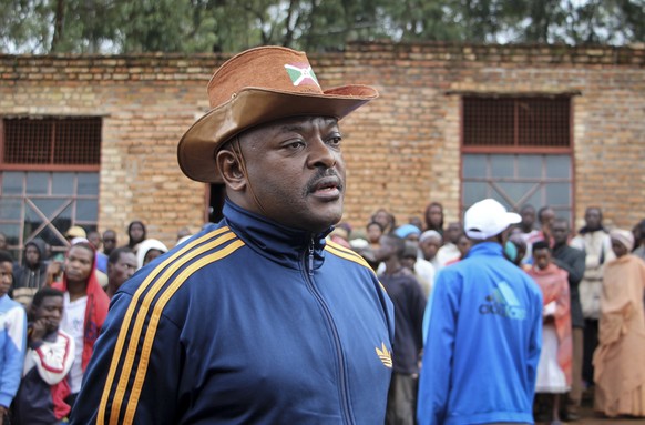 FILE - In this Thursday, May 17, 2018 file photo, Burundi&#039;s President Pierre Nkurunziza speaks to the media after casting his vote in the constitutional referendum in Buye, northern Burundi. Buru ...