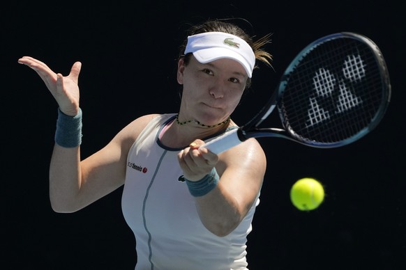 Lulu Sun of Switzerland plays a forehand return to Elisabetta Cocciaretto of Italy during their first round match at the Australian Open tennis championships at Melbourne Park, Melbourne, Australia, T ...