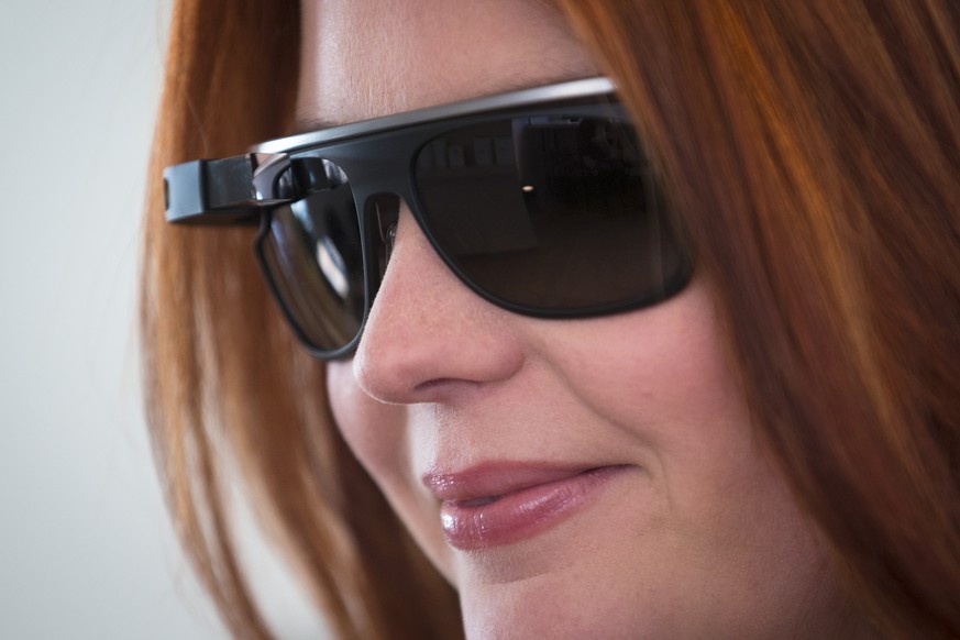 The new Google Glass &quot;Classic&quot; sunglass frames in charcoal color are modeled at the Google Glass Basecamp space at Chelsea Market, Friday, Jan. 24, 2014, in New York. (AP Photo/John Minchill ...