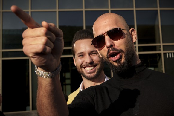 Andrew Tate gestures, next to his brother Tristan, outside the Bucharest Tribunal in Bucharest, Romania, Thursday, Jan. 9, 2025. (AP Photo/Vadim Ghirda)
APTOPIX Romania Andrew Tate