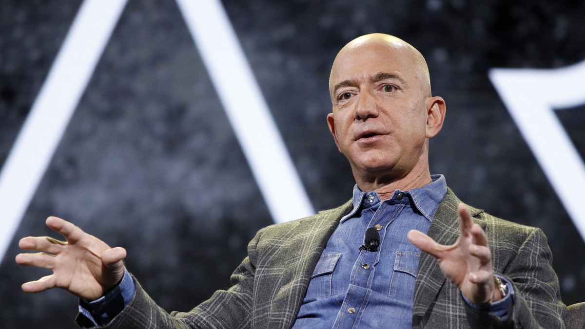 FILE - In this June 6, 2019 file photo, Amazon CEO Jeff Bezos speaks at the the Amazon re:MARS convention, in Las Vegas. Bezos will be aboard for Blue Origin's first human space flight next month ...
