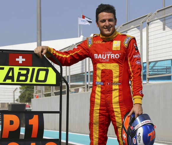 Swiss GP2 racing driver Fabio Leimer poses for photographers at the Yas Marina racetrack in Abu Dhabi, United Arab Emirates, Sunday, Nov. 3, 2013. Leimer secured the GP2 Drivers&#039; Championship tit ...