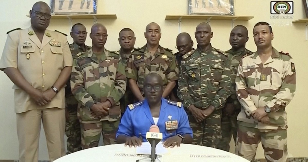 In this image taken from video provided by ORTN, Col. Maj. Amadou Abdramane, front center, makes a statement late Wednesday, July 26, 2023, in Niamey, Niger, as a delegation of military officers appea ...