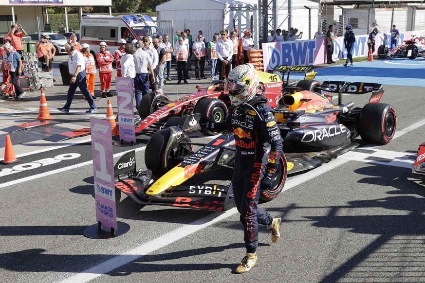 Red Bull driver Max Verstappen of the Netherlands walks from his car after winning the Italian Grand Prix race at the Monza racetrack, in Monza, Italy, Sunday, Sept. 11, 2022. (AP Photo/Ciro De Luca,  ...