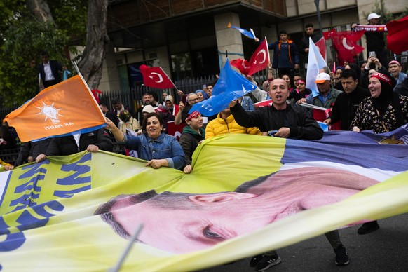 Supporters of the Turkish President Recep Tayyip Erdogan shout slogans outside his house in Istanbul, Turkey, Sunday, May 28, 2023. President Recep Tayyip Erdogan, who has been at Turkey&#039;s helm f ...