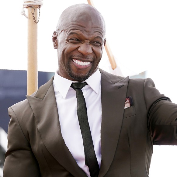 Actor and television personality Terry Crews salutes audience members during a ceremony to award him a star on the Hollywood Walk of Fame, Friday, July 30, 2021, in Los Angeles. (AP Photo/Chris Pizzel ...