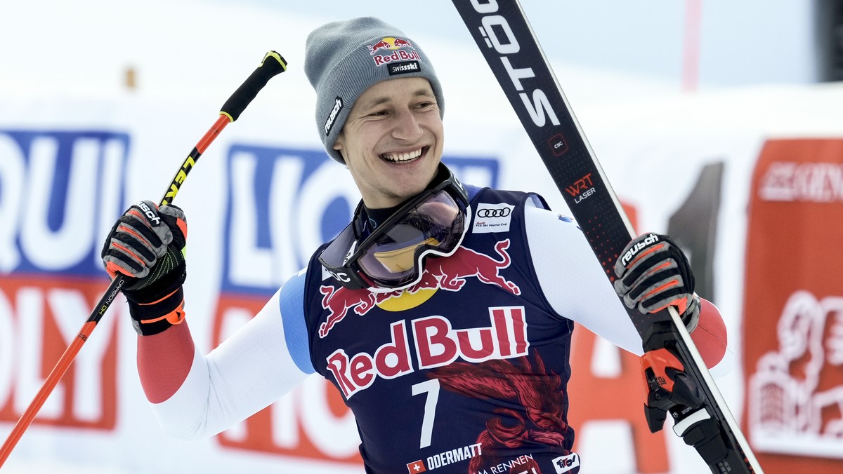 Switzerland's Marco Odermatt celebrates taking second place in an alpine ski, men's World Cup downhill, in Kitzbuehel, Austria, Sunday, Jan. 23, 2022. (AP Photo/Giovanni Auletta)