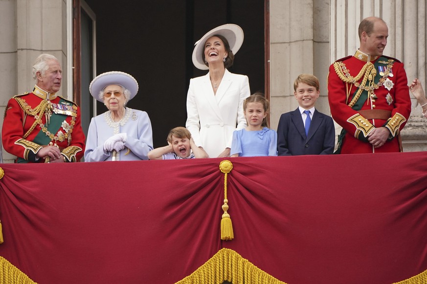 Prince Charles, Queen Elizabeth II, Prince Louis, Kate, Duchess of Cambridge, Princess Charlotte, Prince George and Prince William gather on the balcony of Buckingham Palace, London, as they watch a f ...