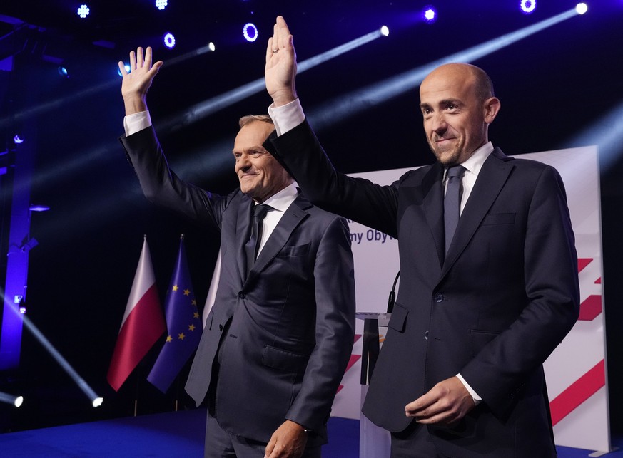 Leader of main opposition party Civic Platform Borys Budka, right, and former Polish Prime Minister Donald Tusk, left, attend a congress of Poland&#039;s opposition Civic Platform party that he is ret ...