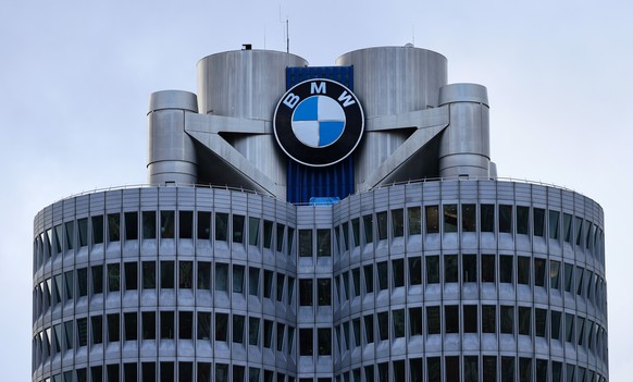 epa12727558 An exterior view of the BMW main tower at BMW headquarters in Munich, Germany, 11 February 2026. BMW said it is recalling hundreds of thousands of cars worldwide that can catch fire while  ...