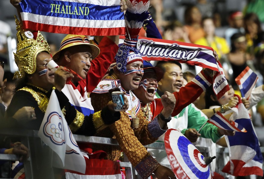 Fans cheer on athletes from Thailand during the women&#039;s 58kg weightlifting competition at the 2016 Summer Olympics in Rio de Janeiro, Brazil, Monday, Aug. 8, 2016. (AP Photo/Mike Groll)