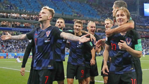 Football: Argentina vs Croatia at World Cup Ivan Rakitic (L), Luka Modric (R) and other Croatia players celebrate after Rakitic scored a goal during the second half of a World Cup group stage match ag ...