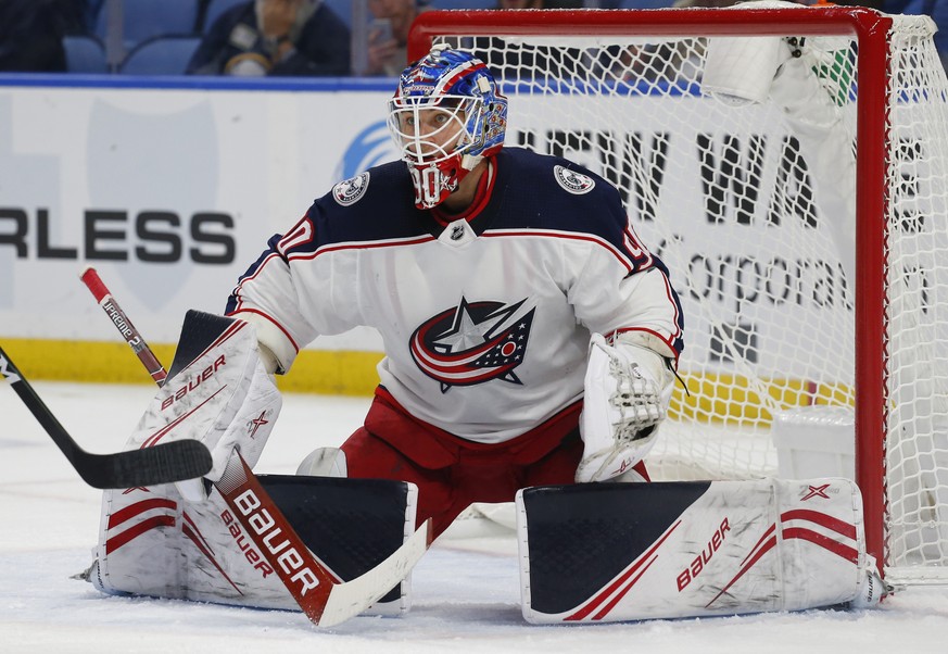Columbus Blue Jackets goalie Elvis Merzlikins (90) makes a save during the first period of an NHL preseason hockey game against the Buffalo Sabres, Wednesday, Sept. 25, 2019, in Buffalo N.Y. (AP Photo ...
