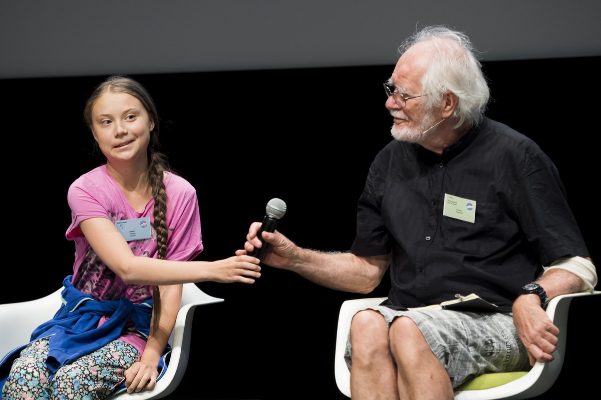 epa07757805 Swedish climate activist Greta Thunberg, reacts next to Jacques Dubochet from Switzerland, Nobel laureate in Chemistry, during a press conference of the 'Fridays For Future Summit ...