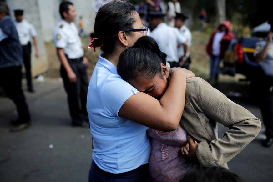 Family members react as they wait for news of their loved ones after a fire broke out at the Virgen de Asuncion home in San Jose Pinula on the outskirts of Guatemala City, March 8, 2017. REUTERS/Saul  ...