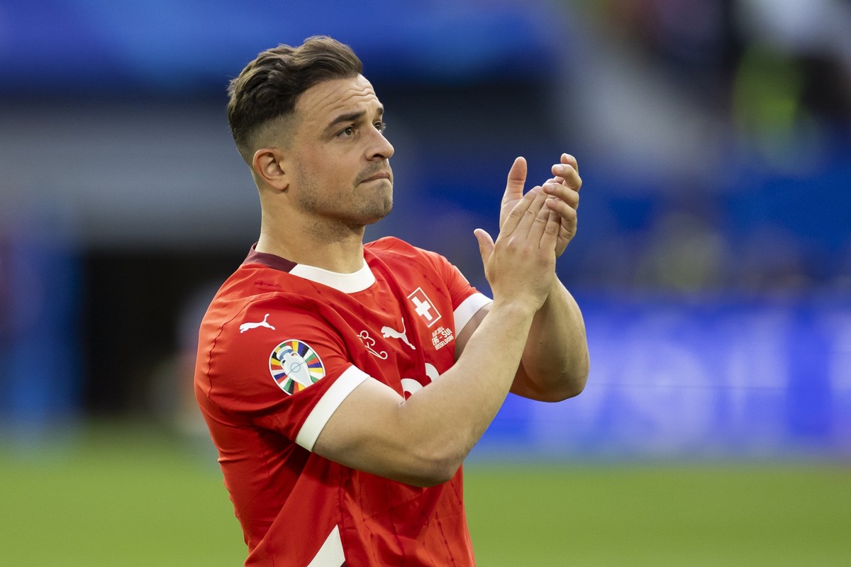 Switzerland's Xherdan Shaqiri is disappointed after losing the penalty shoot-out of the quarter final match between England and Switzerland at the Euro 2024 soccer tournament in Duesseldorf, Germ ...