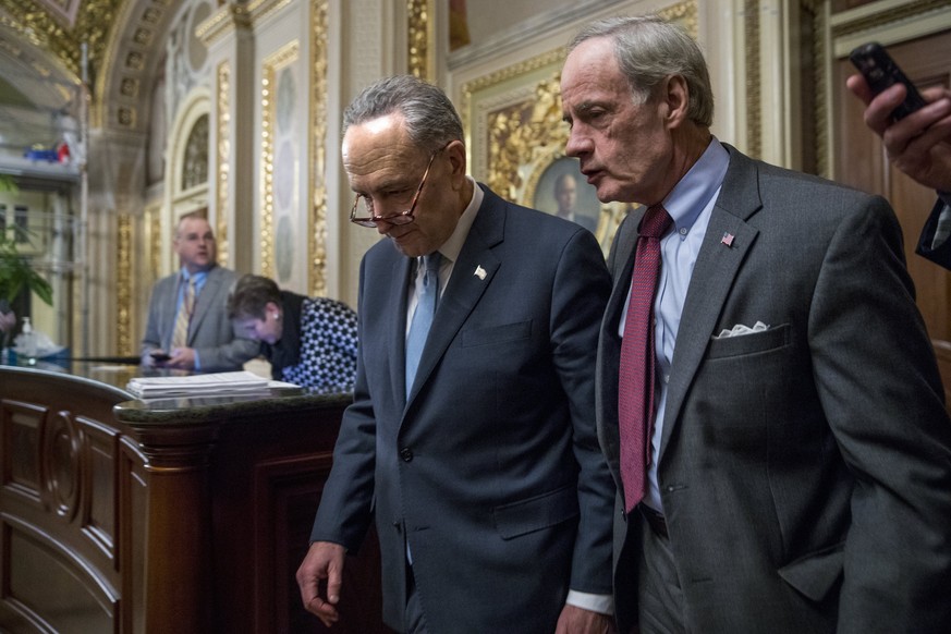 epa06455660 Senate Minority Leader Chuck Schumer (L) and US Democratic Senator from Delaware Tom Carper (R) walk out of a meeting of the Democratic senators in the US Capitol in Washington, DC, USA, 1 ...