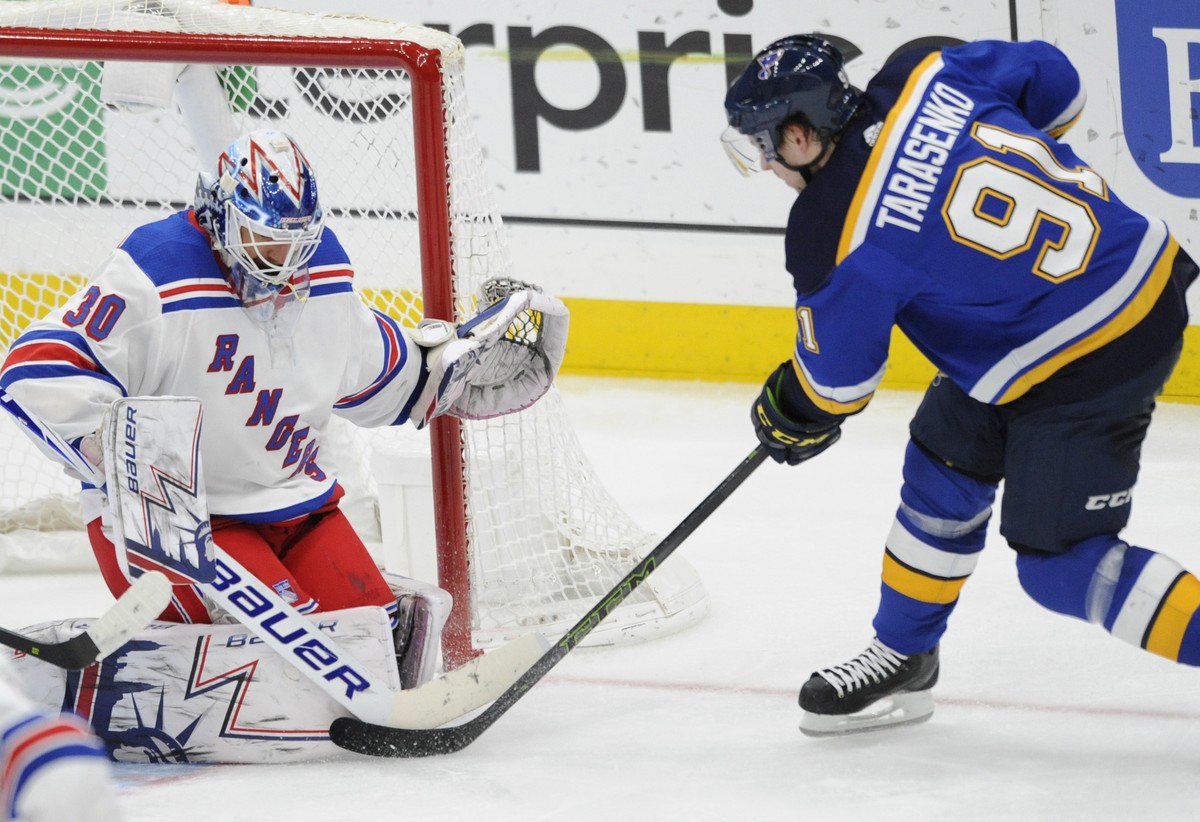 New York Rangers goalie Henrik Lundqvist (30), of Sweden, blocks a shot by St. Louis Blues' Vladimir Tarasenko (91), of Russia, during the second period of an NHL hockey game Monday, Dec. 31, 201 ...