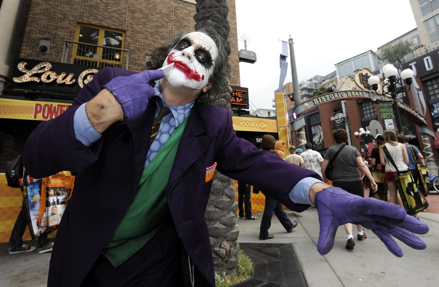 Fan Stuart Mazzeo, dressed as the Joker, poses for photographers on day two of Comic-Con International held at the San Diego Convention Center on Friday July 13, 2012, in San Diego. (Photo by Denis Po ...