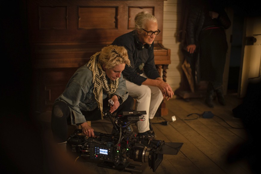 This image released by Netflix shows cinematographer Ari Wegner, left, with producer-director Jane Campion on the set of &quot;The Power of the Dog.&quot; (Netflix via AP)