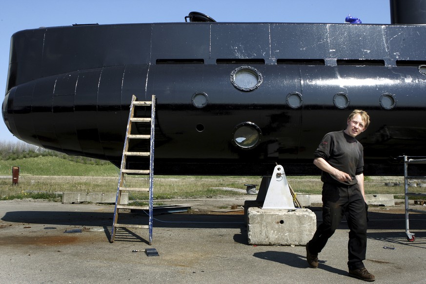 FILE - This April 30, 2008 file photo shows a submarine and its owner Peter Madsen. Peter Madsen stands trial at Copenhagen’s City Court on Thursday March 8, 2018, for the killing of Kim Wall, 30, in  ...