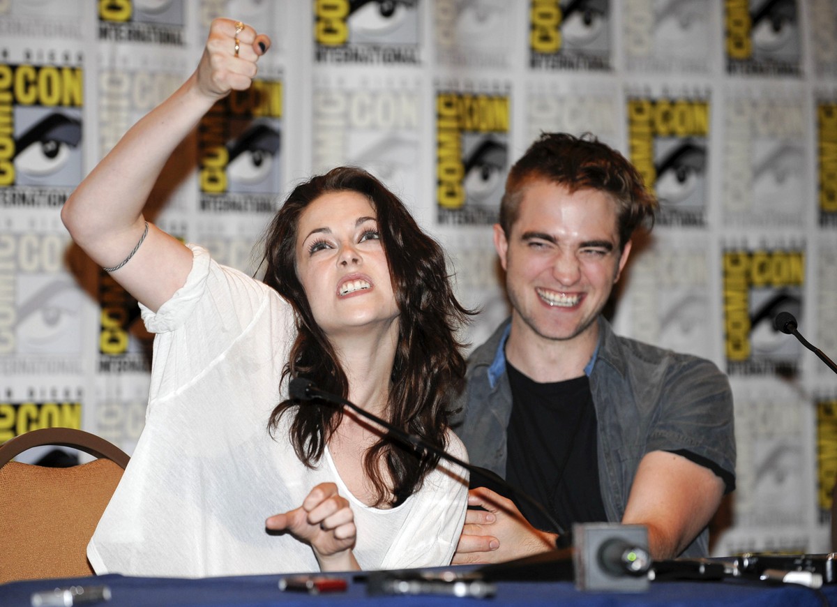 Kristen Stewart, left, and Robert Pattinson talk during a panel for their film "The Twilight Saga: Breaking the Dawn Part 1" at the Comic-Con International 2011 convention in San Diego Thurs ...